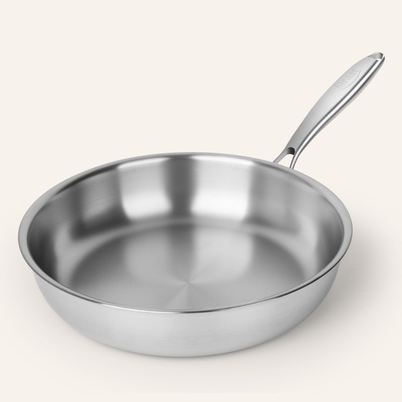 Siraat Titanium Pan Pro, a smooth pure titanium frying pan with no coating, angled close-up view